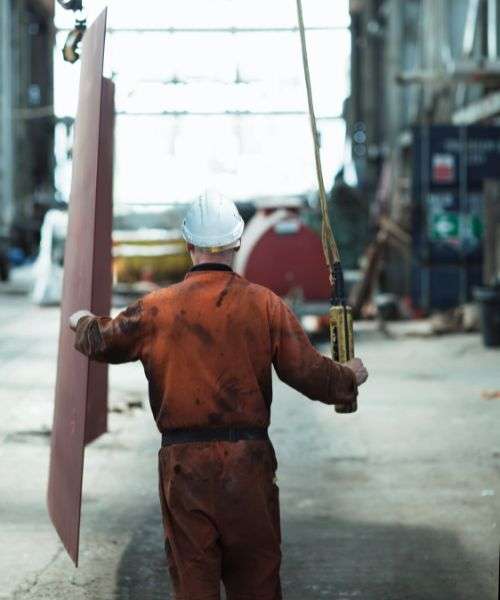 Industrial worker with a wrench at a workplace with chemicals